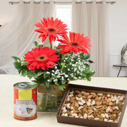 Red Gerberas with Rasgulla and Dry Fruit Hamper