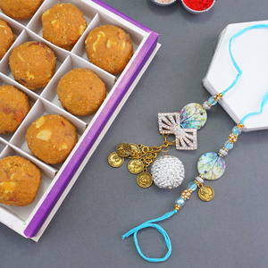 Pair of Graceful Rakhis with Sweets for Bhaiya Bhabhi