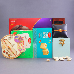 Two Rakhis with Sweets N Cookies Gift Hamper