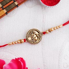 Golden OM Rakhi - Send Rakhi to Faridabad