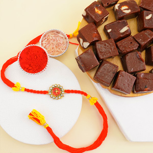 Auspicious Golden Ganesha Rakhi with Sweets - Send Rakhi to Noida