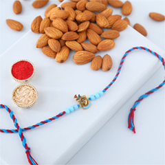 Sneh Blue Krishna Rakhi with Almonds - Rakhi Cards to UAE