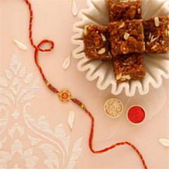 Sneh Traditional Om Rakhi with Dodha Burfi - Rakhi Cards to UAE