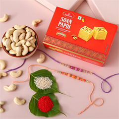 Sneh Peachy Rakhi Set with 250 Grams Soan Papdi and Cashew - Rakhi Cards to UAE