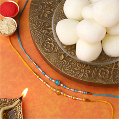 Sneh Vibrant Set Of 2 Pearl Rakhis with 1 Kg Rasgulla Tin - Rakhi Sweets to UAE