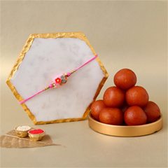 Fancy Stone Rakhi with 1 Kg Gulab Jamun Tin - Rakhi Sweets to UAE