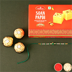 Sneh Fancy Green Rakhi with 3 Pcs Ferrero Rocher and Soan Papdi - Rakhi Sweets to UAE