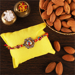 Ganesha Studded Rakhi and Almond - Rakhi and Dry Fruits to USA