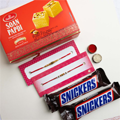 White Golden Pearl Set of 2 Rakhis With Soan Papdi & Snickers - Rakhi Sets to Australia
