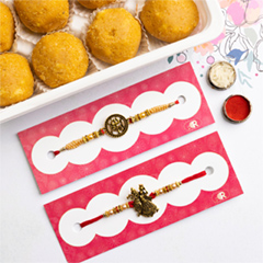 Trishul & Radha Krishna Set of 2 Rakhis With Besan Laddoo - Rakhi Sets to Australia